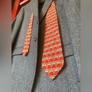 Roundtree and Yorke silk tie. Red/gold/with navy/grey accents.